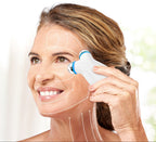 Facial massage device with warming function shown on white background